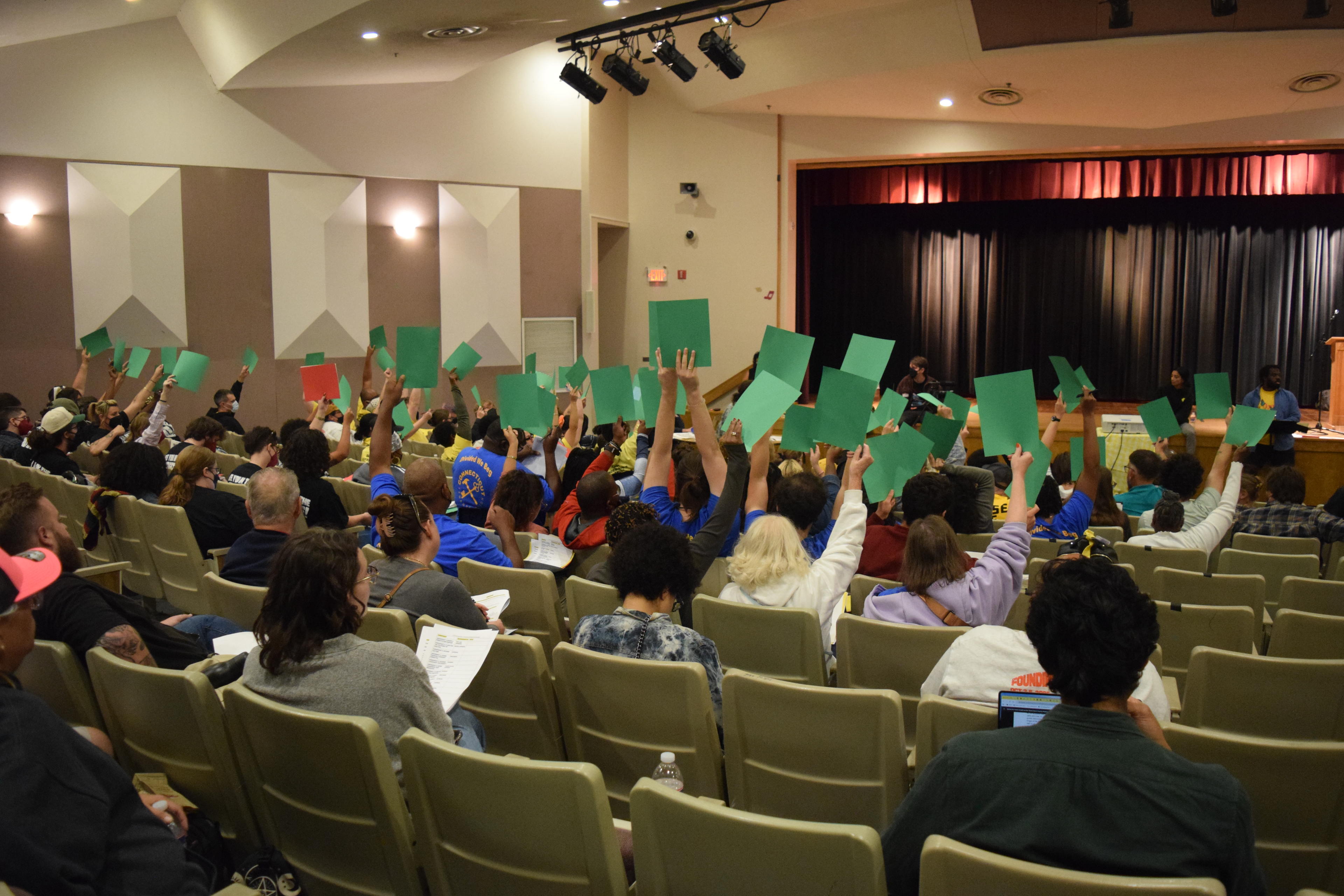 Delegates at the TUF Convention holding up their votes to be counted